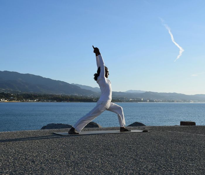 Man meditating peacefully after a workout, showing mental clarity.